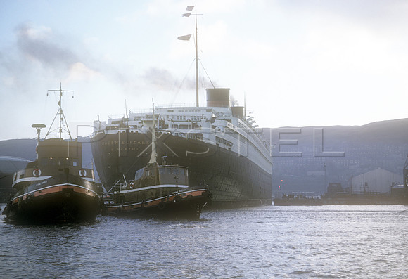 Queen Elizabeth with Tugs